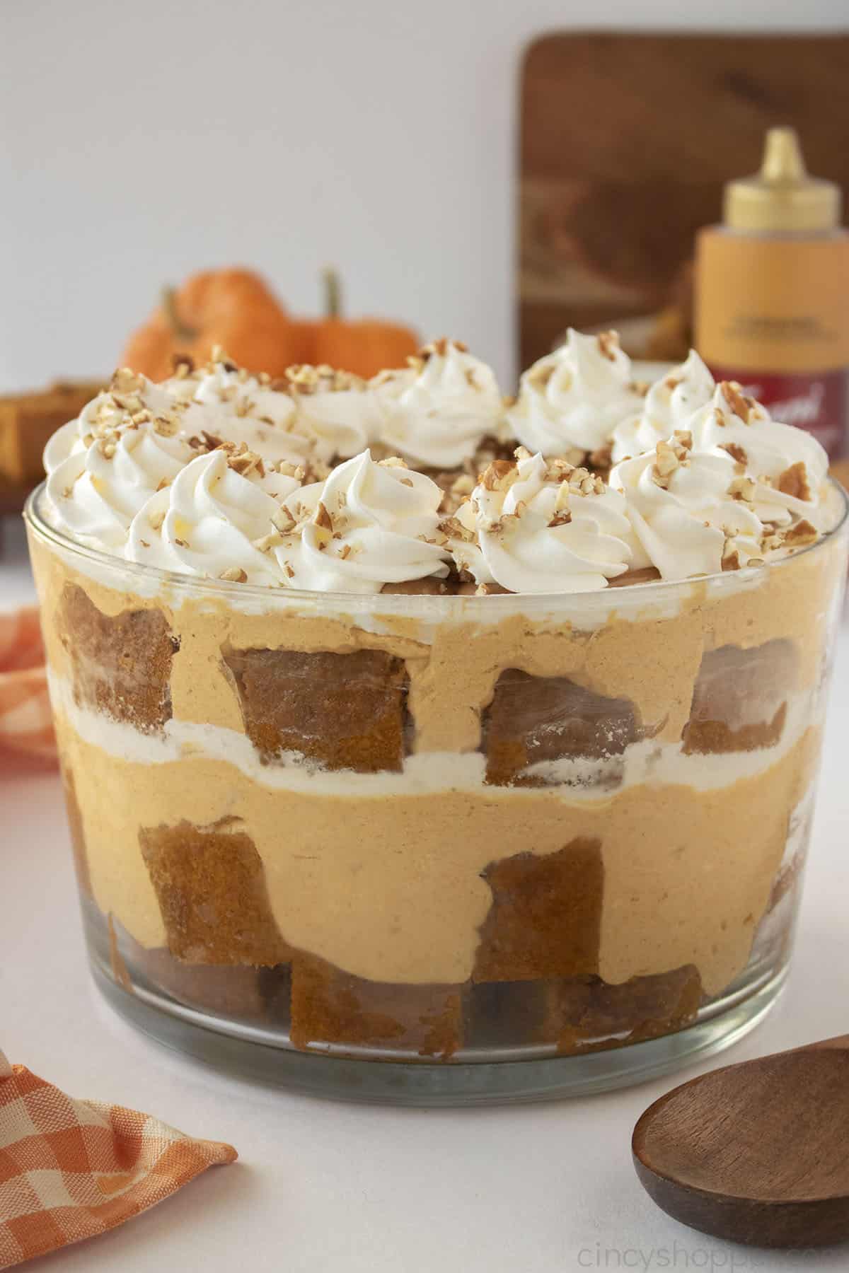 Pumpkin Trifle dessert in a large clear party bowl.