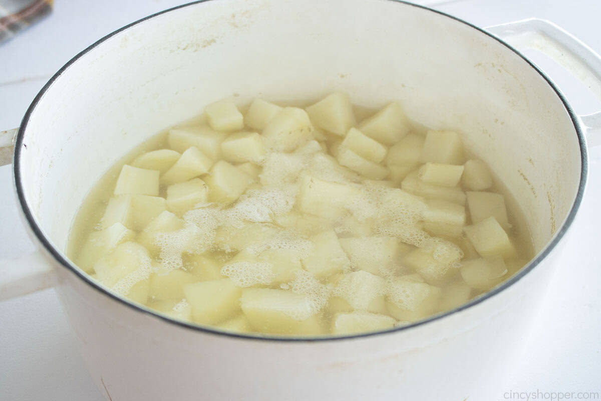 Boiled potatoes in a pot with water.