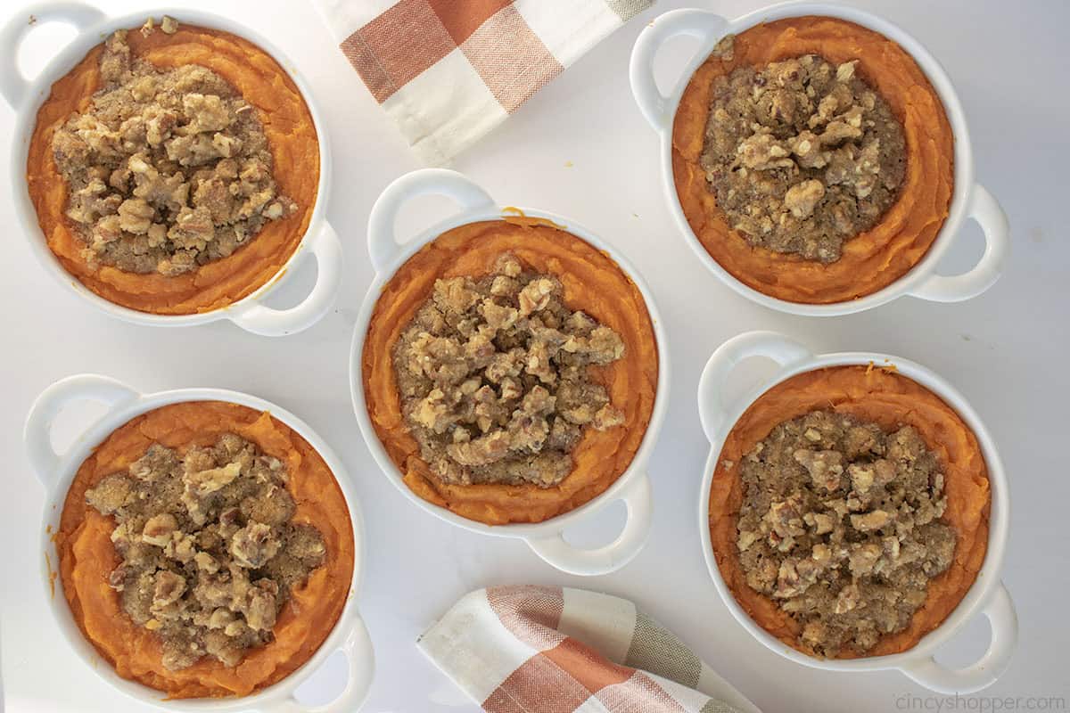 5 individual serving dishes with sweet potato casserole.