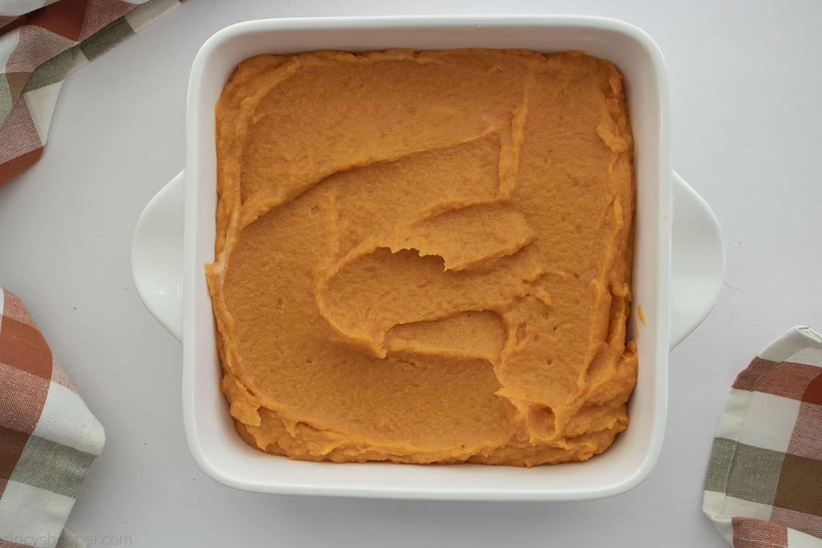 Sweet potato mixture in a white casserole dish.