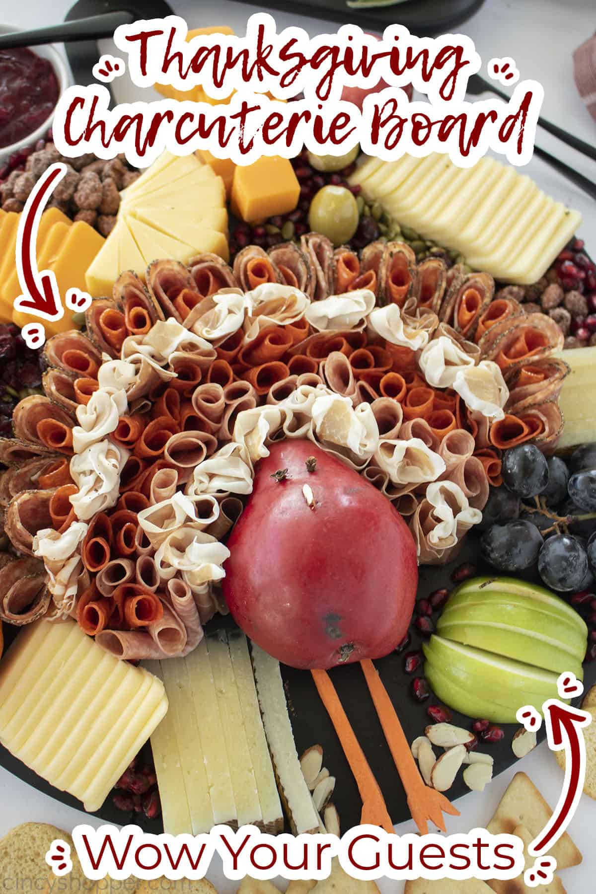 Overhead view of charcuterie board for thanksgiving Text on image Wow your Guests