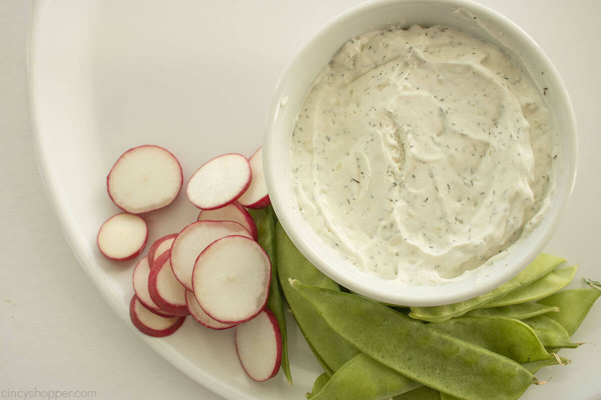 Sliced radishes added to the left of the snow peas.