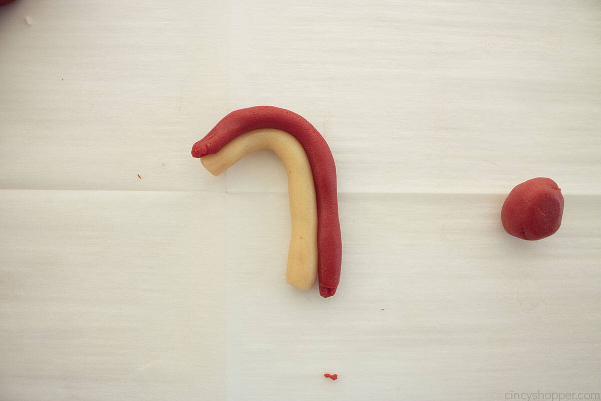 Cookie dough bent into the shape of a candy cane.