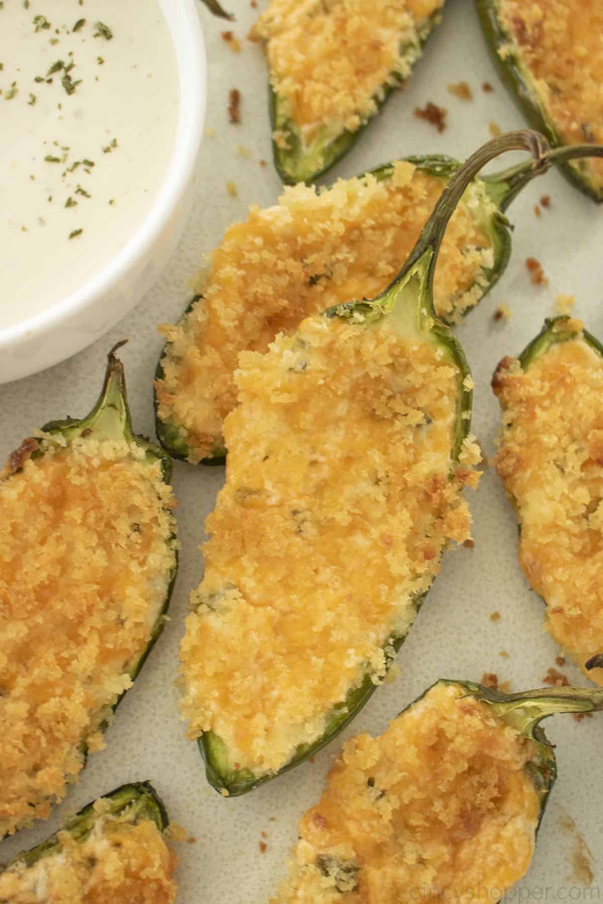Cream Cheese Jalapeno Poppers on a white plate with ranch dip.