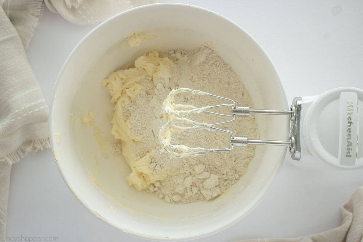 Dry ingredients added to Linzer cookie dough.