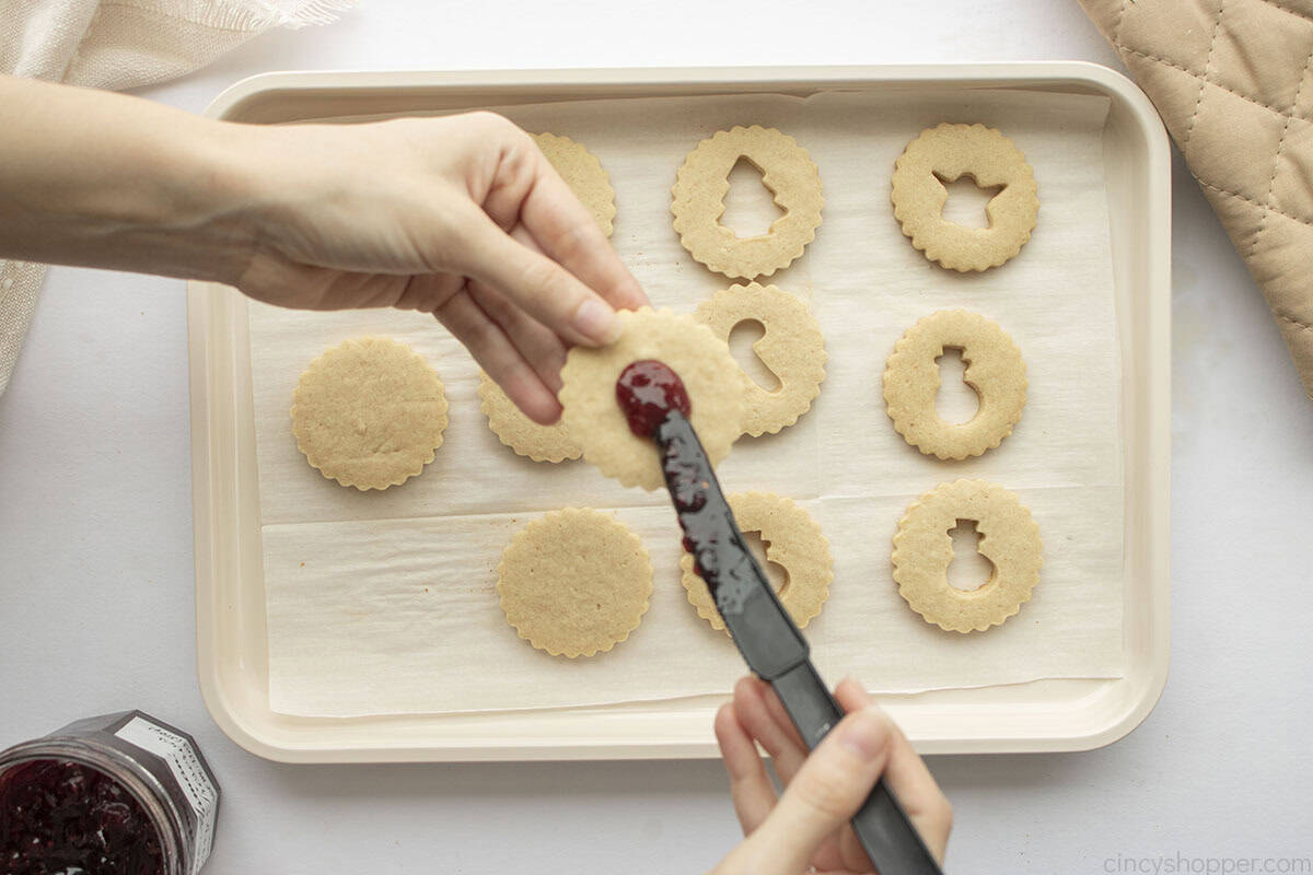 Jam being added to cookie base.