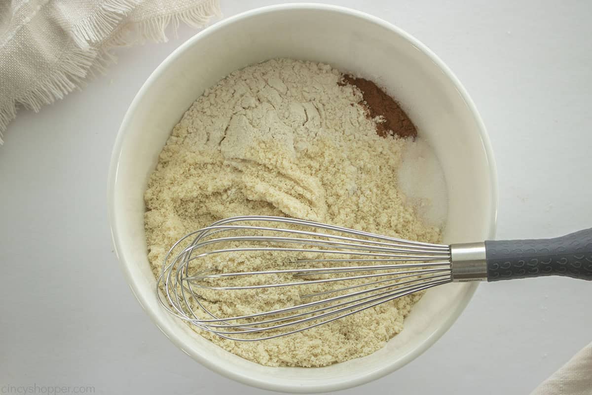 Dry ingredients in a mixing bowl with whisk.