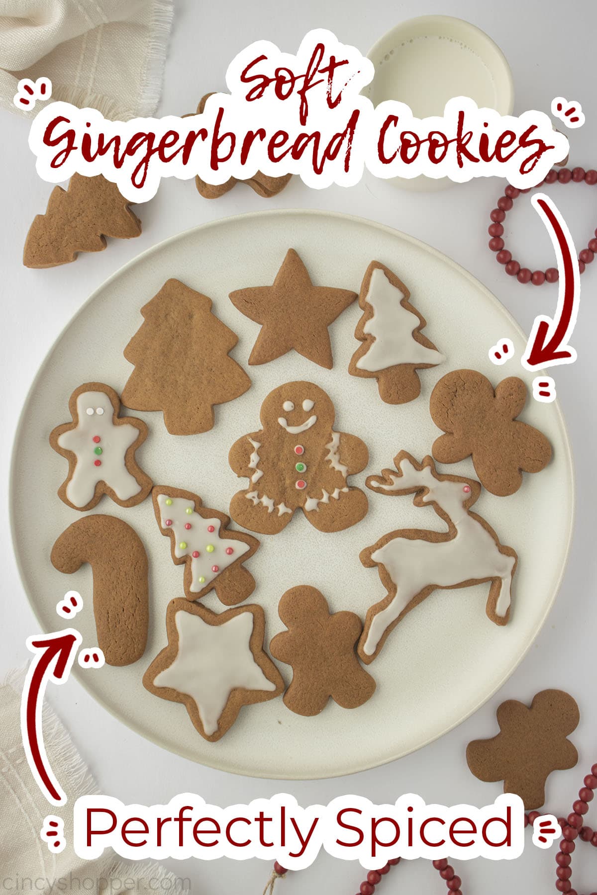 Plate with cut-out gingerbread shaped cookies.