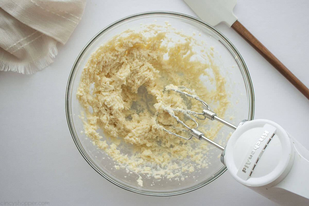 Butter and sugar creamed in a clear mixing bowl.