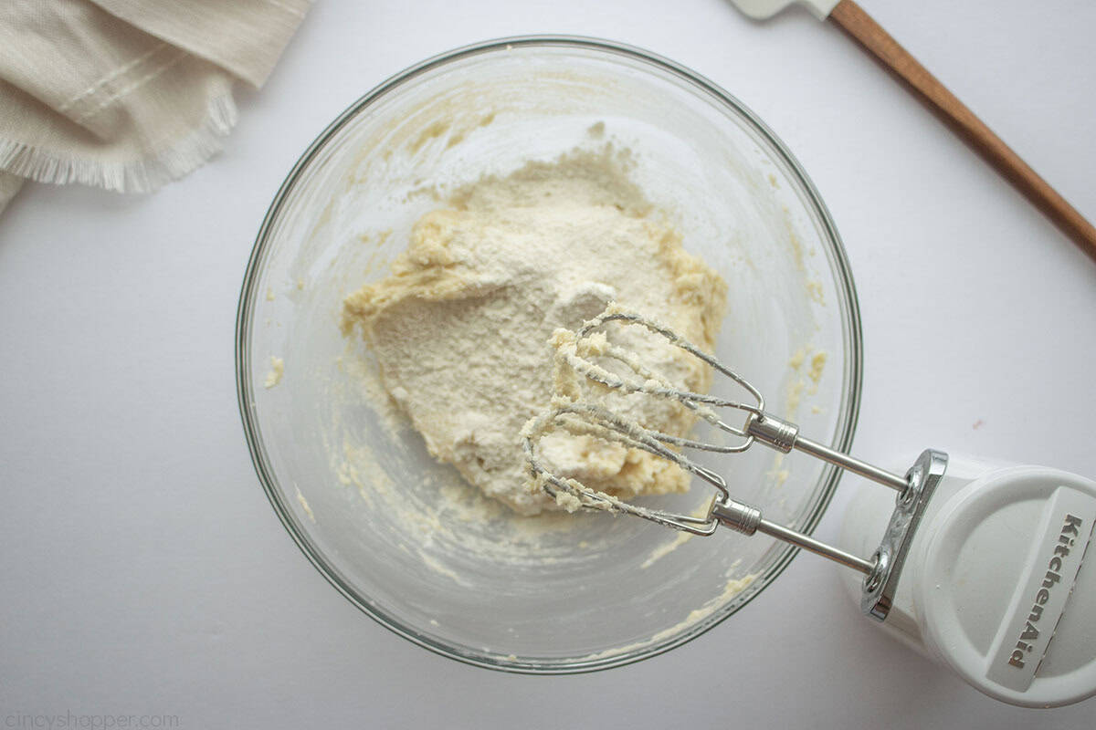 Flour and salt mixture added to cookie dough mixture.