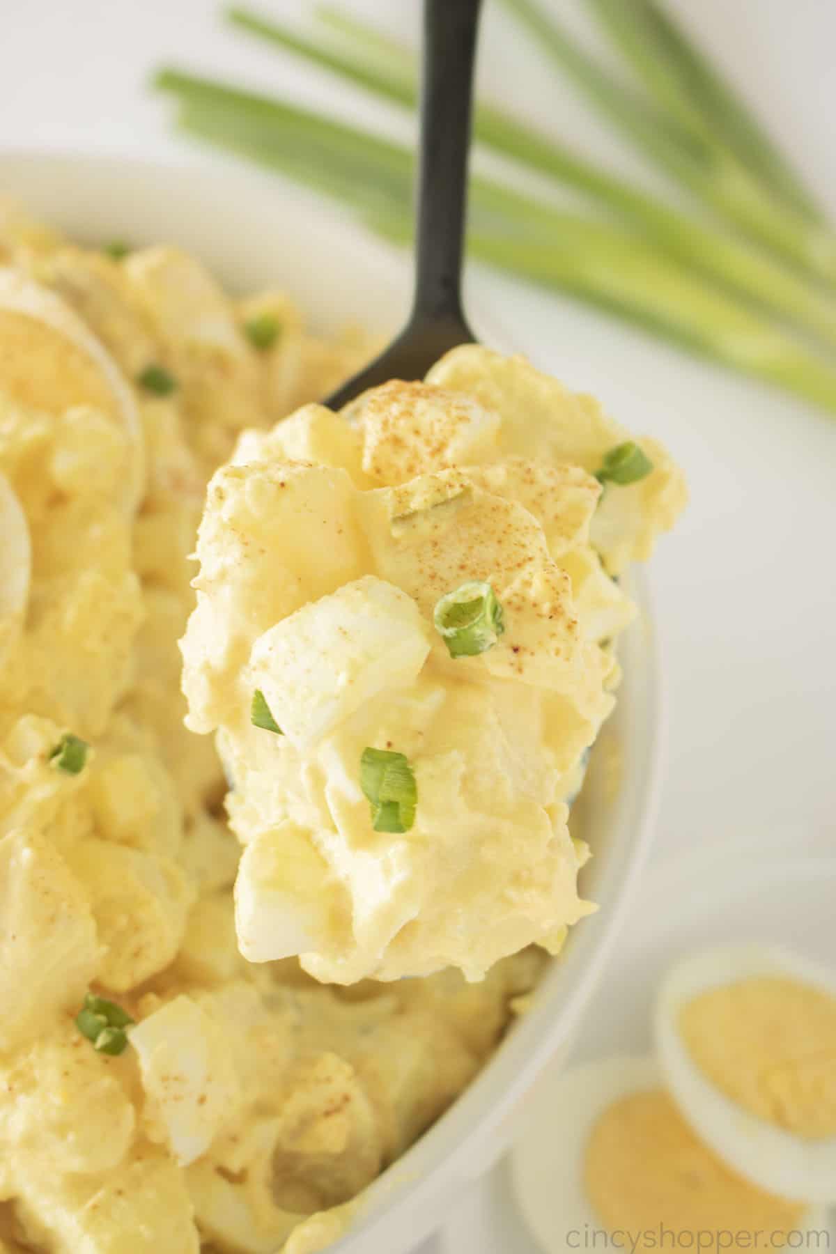 Egg Potato Salad on a spoon.