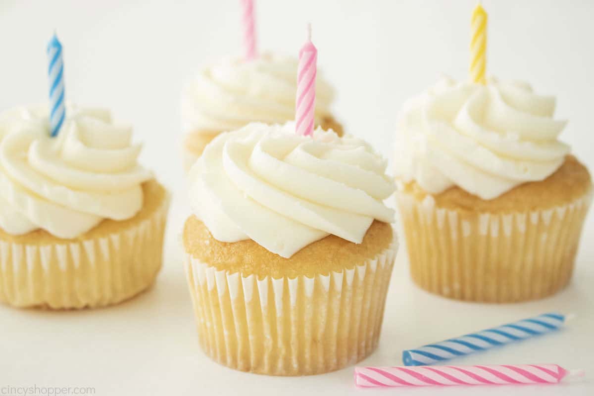 Cupcakes topped with vanilla buttercream frosting.