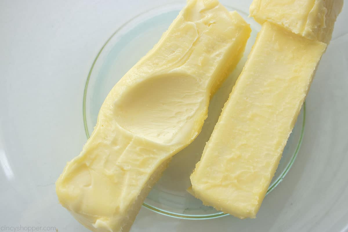 Room temperature Butter in a clear bowl.