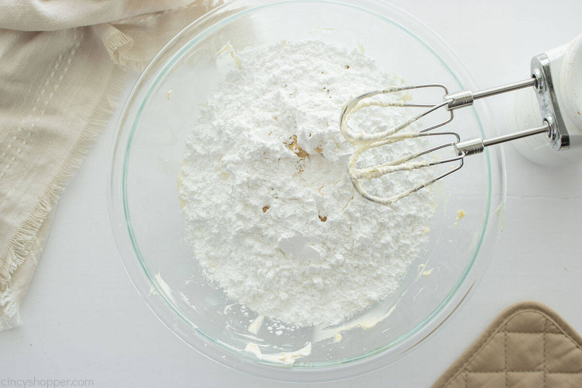 Powdered sugar and vanilla added to creamed butter.