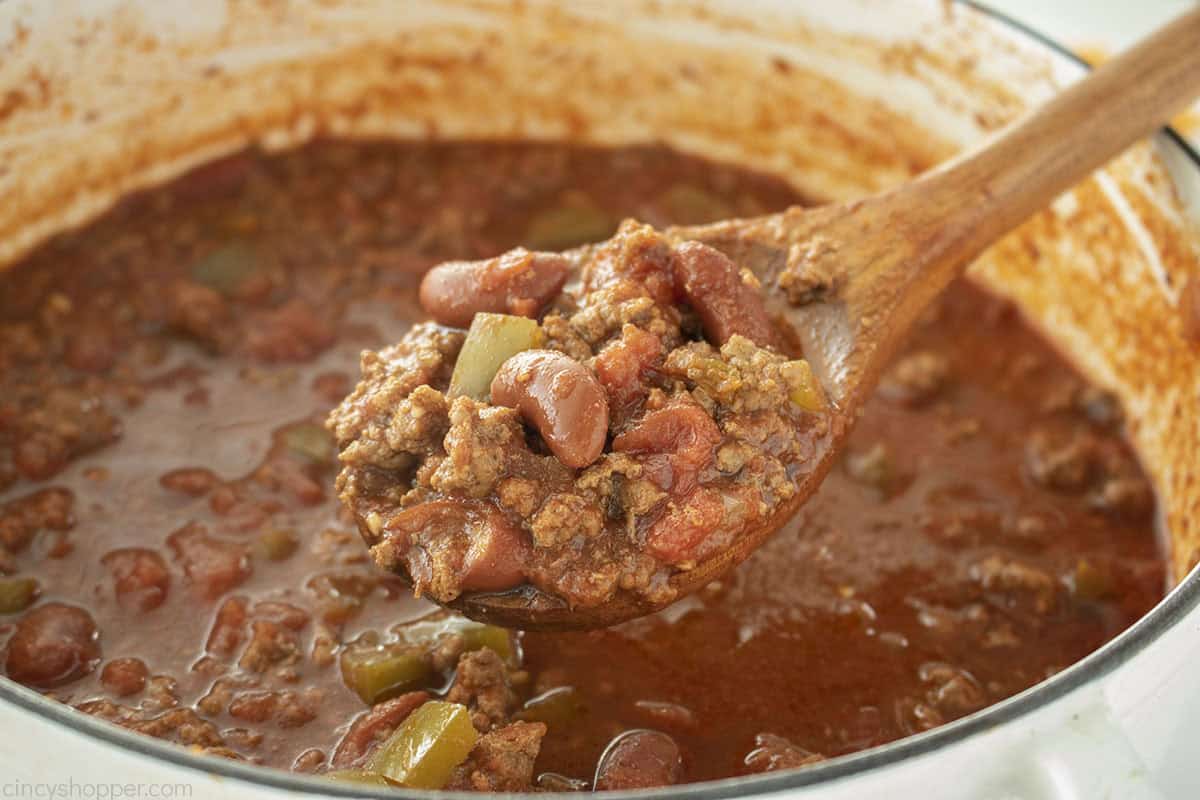 Cooked chili on a spoon.