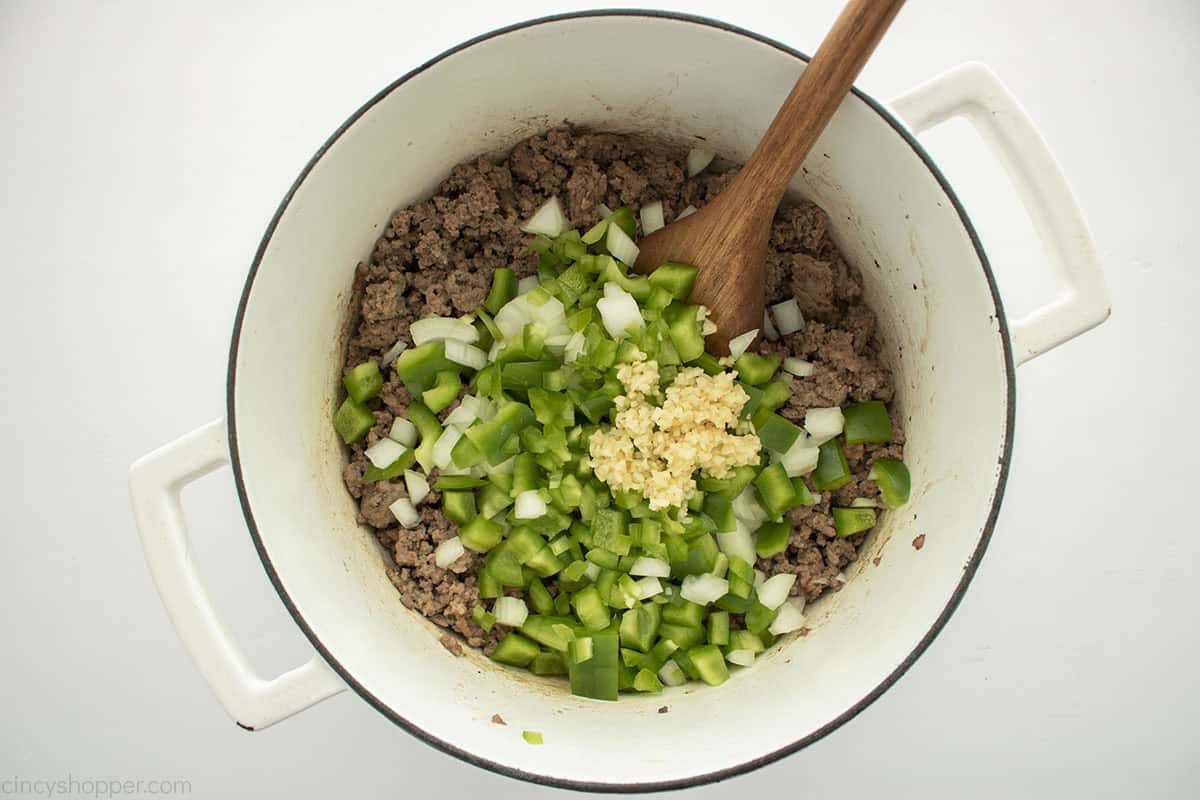 Vegetables and garlic added to ground beef.