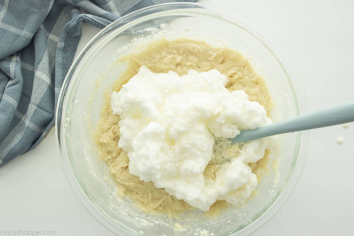 Whipped egg whites added to cake mix.
