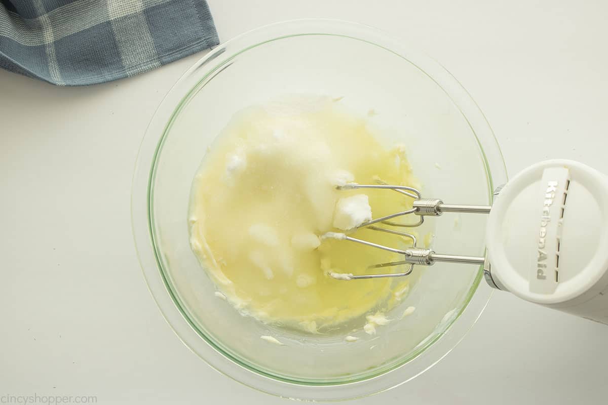Oil and sugar added to creamed butter.