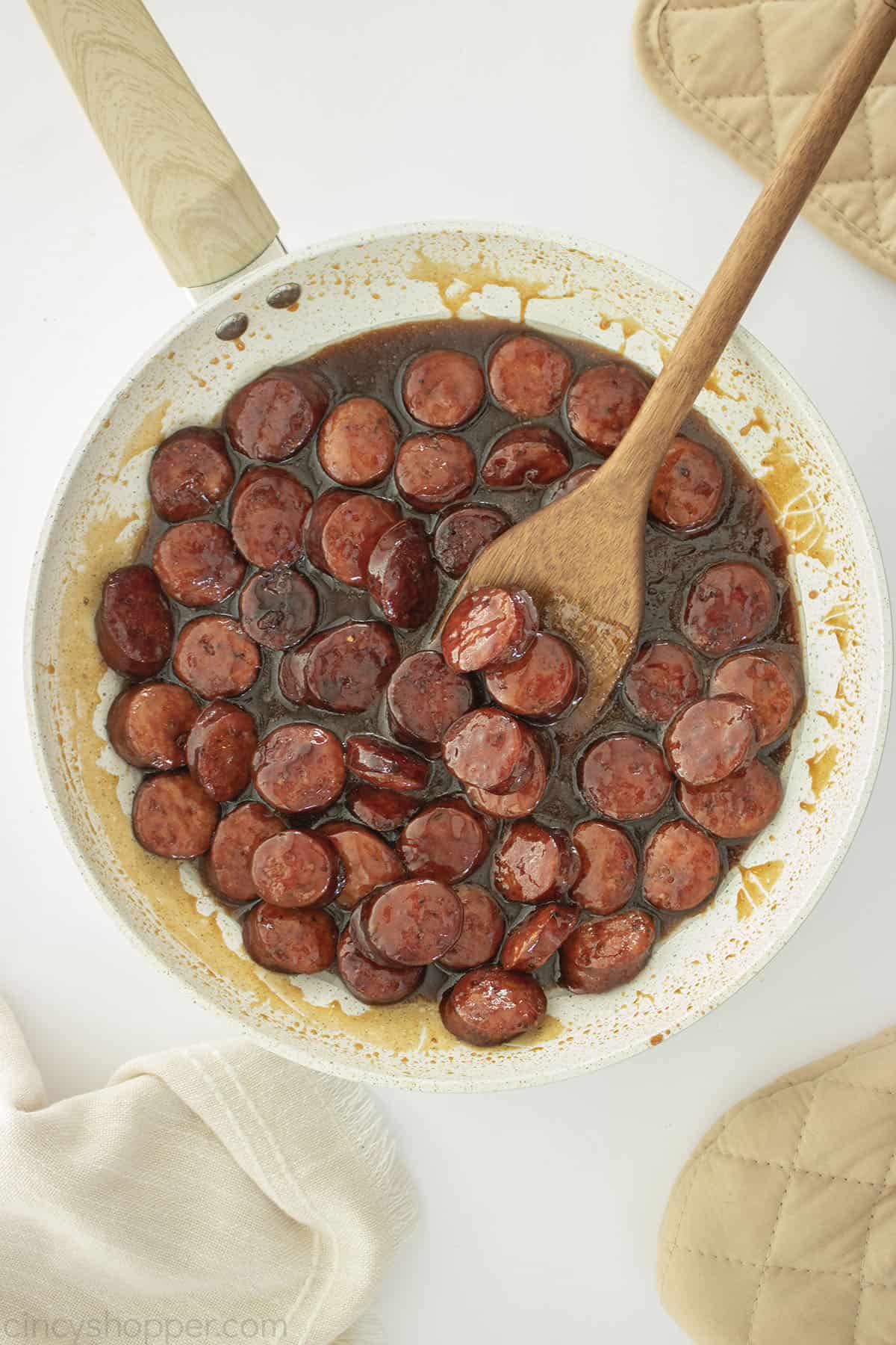 Brown Sugar Kielbasa Bites in a white pan.
