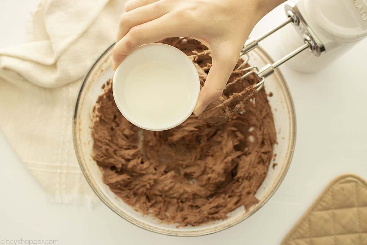 Milk added to chocolate butter mixture.