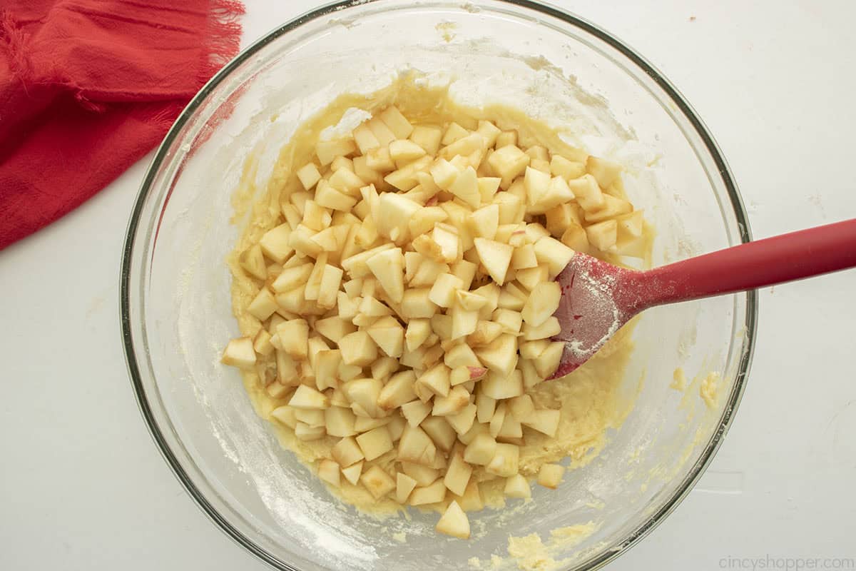Apples added to cake batter.